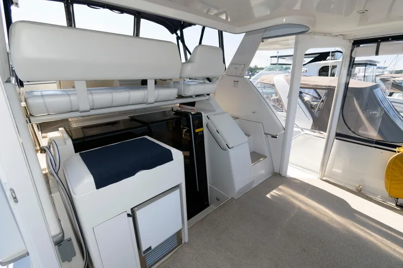 Slide: The Image of Interior of 1997 Carver 400 Cockpit Motor Yacht with seating and stairs. - 6