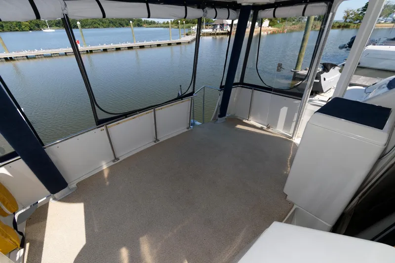 Slide: The Image of 1997 Carver 400 Cockpit Motor Yacht with spacious deck area. - 7