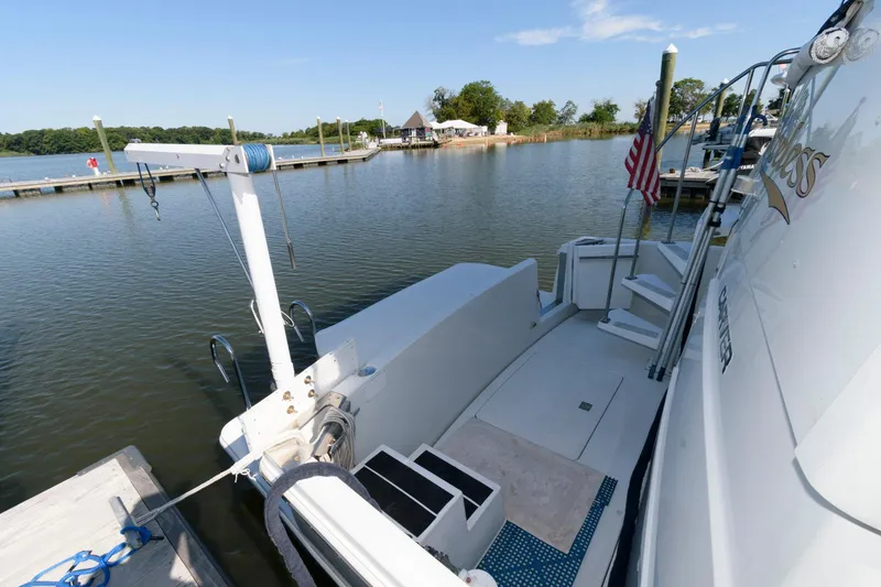 Slide: The Image of 1997 Carver 400 Cockpit Motor Yacht docked with scenic water view. - 8