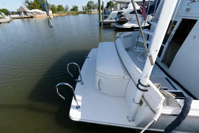 Slide: The Image of 1997 Carver 400 Cockpit Motor Yacht docked at marina. - 9