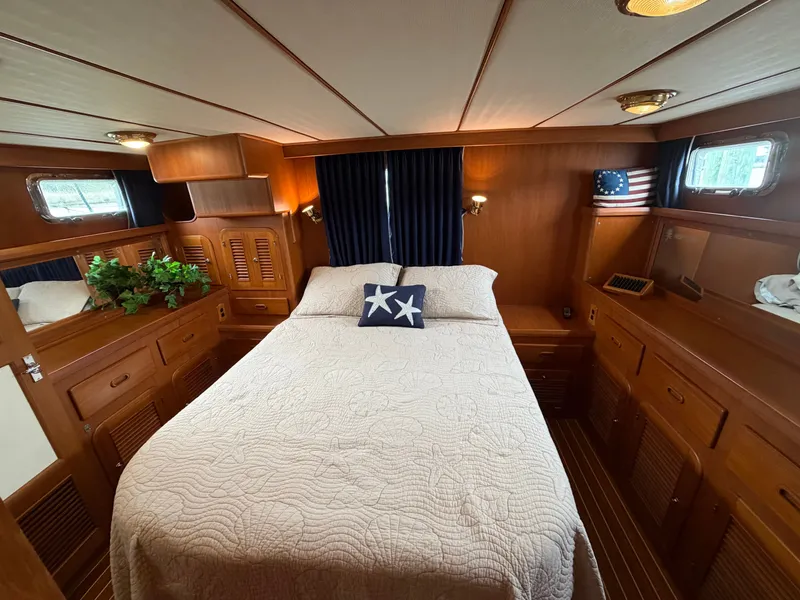 Slide: The Image of Interior of 2002 Heritage East 36 Sundeck yacht featuring cozy bedroom. - 10