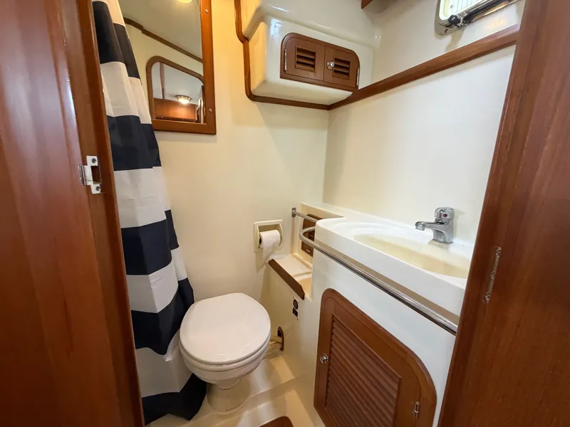 Slide: The Image of Bathroom of the 2002 Heritage East 36 Sundeck yacht. - 13