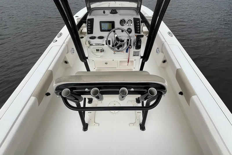 Slide: The Image of 2017 Robalo 246 Cayman boat cockpit with steering wheel and navigation equipment. - 10