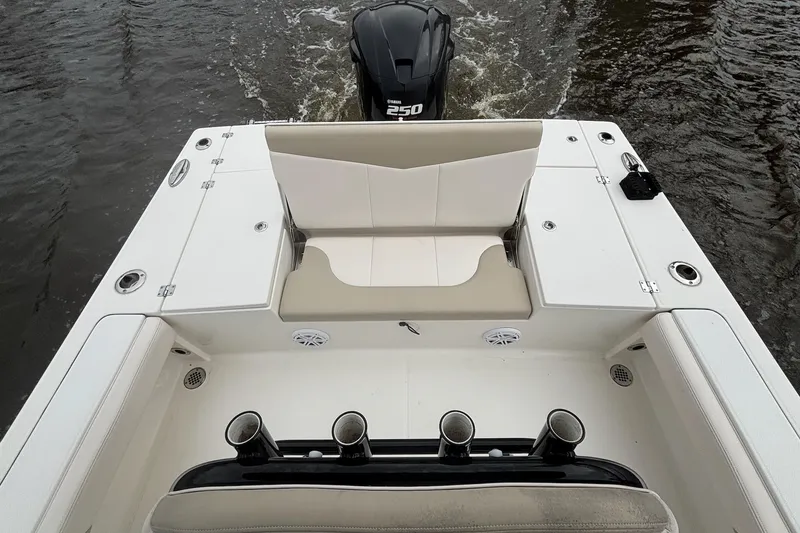 Slide: The Image of 2017 Robalo 246 Cayman boat with Yamaha 250 engine, featuring spacious seating and rod holders. - 11