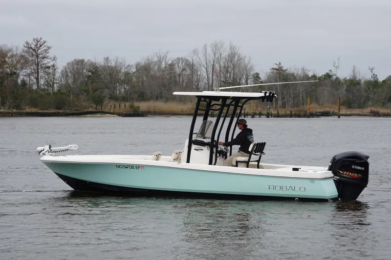 Slide: The Image of 2017 Robalo 246 Cayman boat on calm water with Yamaha engine. - 5