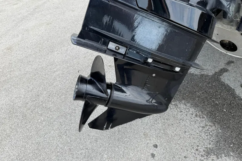 Slide: The Image of 2023 Bennington 24SSRC boat propeller on pavement background. - 12