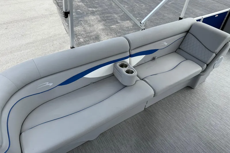 Slide: The Image of 2023 Bennington 24SSRC pontoon boat with gray seating and cup holders. - 17