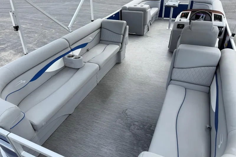 Slide: The Image of 2023 Bennington 24SSRC pontoon boat interior with gray seating and modern design. - 18