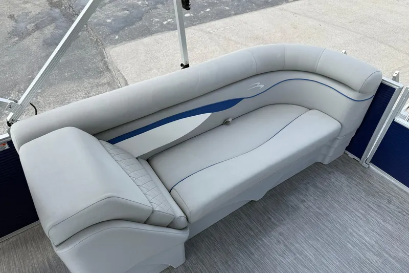 Slide: The Image of 2023 Bennington 24SSRC boat interior with sleek, modern seating design. - 19