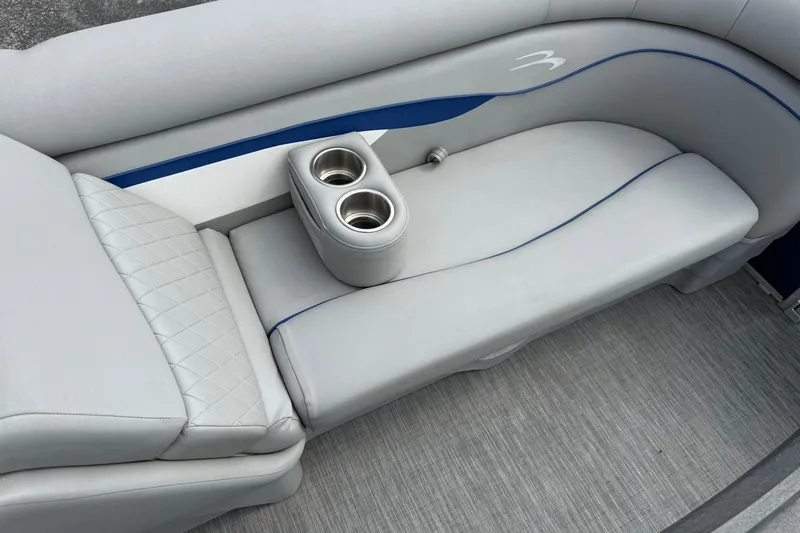 Slide: The Image of 2023 Bennington 24SSRC boat interior with gray seating and cup holders. - 21