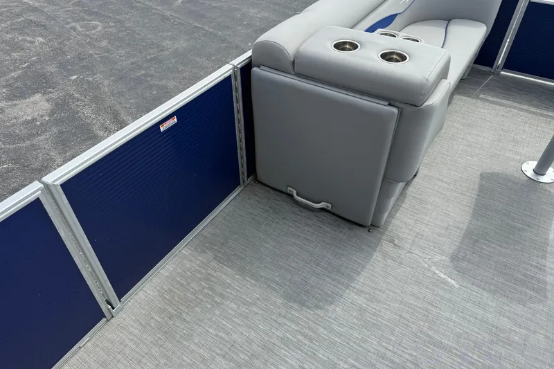 Slide: The Image of 2023 Bennington 24SSRC pontoon boat interior with gray seating and cup holders. - 24