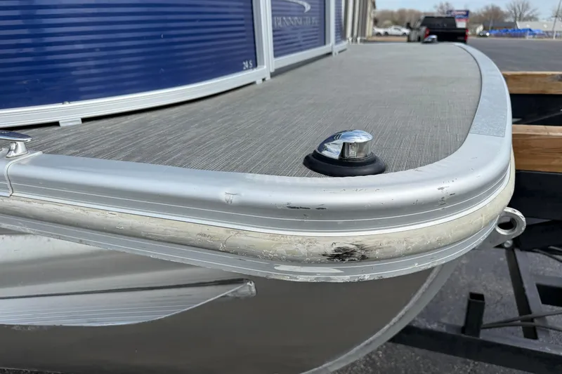 Slide: The Image of 2023 Bennington 24SSRC pontoon boat, close-up of bow with metallic finish. - 31