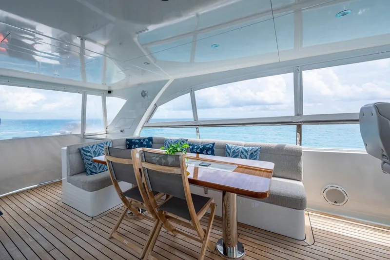 Slide: The Image of Luxurious 2018 Cheoy Lee Bravo 78 yacht interior with ocean view and elegant seating area. - 19