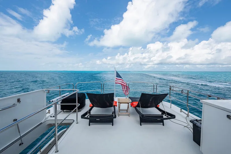 Slide: The Image of 2018 Cheoy Lee Bravo 78 Sport Motor Yacht deck with ocean view and lounge chairs. - 23