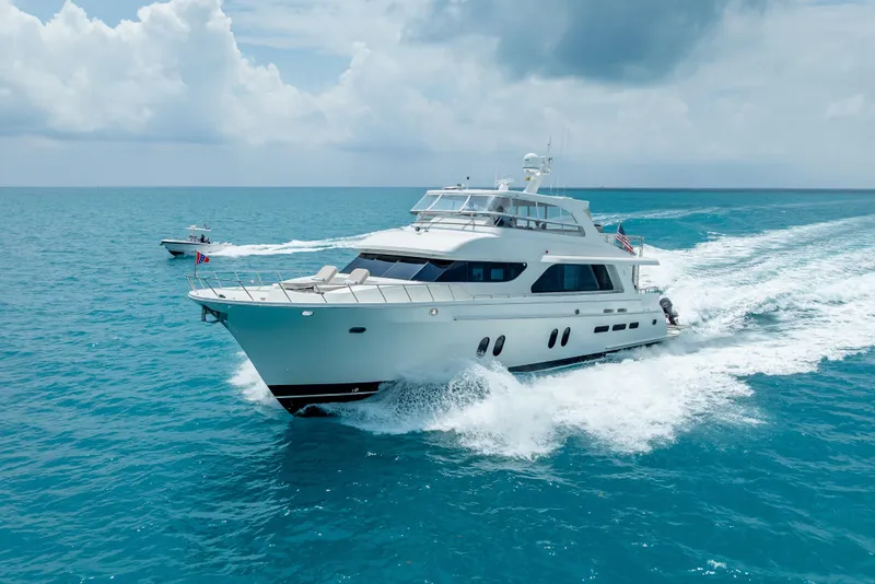 Slide: The Image of 2018 Cheoy Lee Bravo 78 Sport Motor Yacht cruising on open sea under cloudy skies. - 5