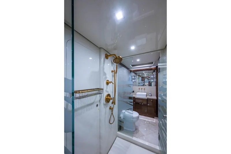 Slide: The Image of Luxurious bathroom in 2018 Cheoy Lee Bravo 78 Sport Motor Yacht with gold fixtures. - 55