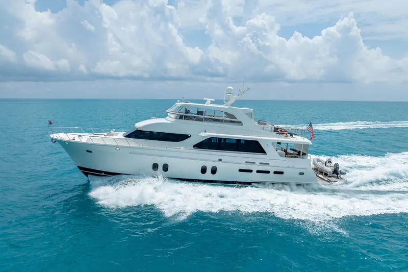 Slide: The Image of 2018 Cheoy Lee Bravo 78 Sport Motor Yacht cruising on turquoise ocean waters. - 6