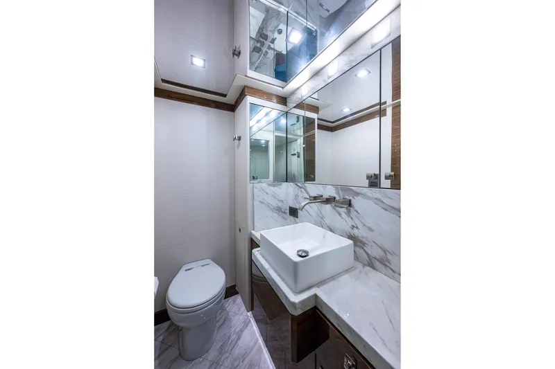 Slide: The Image of Luxurious bathroom in 2018 Cheoy Lee Bravo 78 Sport Motor Yacht with marble countertop and modern fixtures. - 68