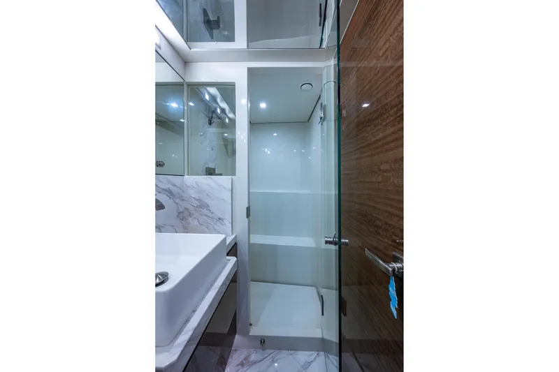 Slide: The Image of Luxurious bathroom in 2018 Cheoy Lee Bravo 78 Sport Motor Yacht with modern glass shower. - 69