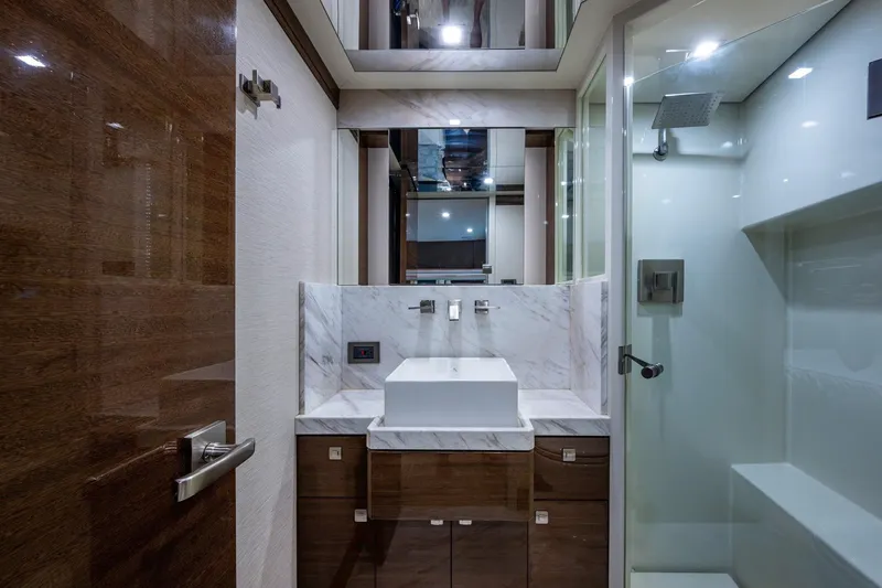 Slide: The Image of Luxurious bathroom in 2018 Cheoy Lee Bravo 78 Sport Motor Yacht with modern fixtures and marble accents. - 74