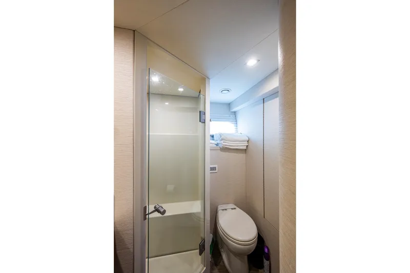 Slide: The Image of Bathroom interior of 2018 Cheoy Lee Bravo 78 Sport Motor Yacht, featuring modern shower and toilet. - 80