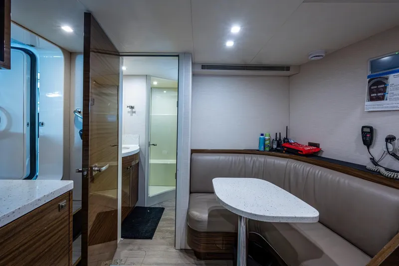 Slide: The Image of Interior of 2018 Cheoy Lee Bravo 78 Sport Motor Yacht with seating and bathroom. - 81