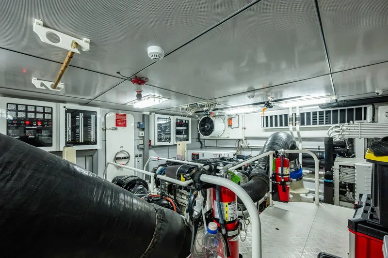 Slide: The Image of Engine room of 2018 Cheoy Lee Bravo 78 Sport Motor Yacht, featuring advanced equipment and controls. - 83