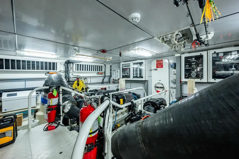 Slide: The Image of Engine room of 2018 Cheoy Lee Bravo 78 Sport Motor Yacht, featuring advanced equipment and controls. - 84