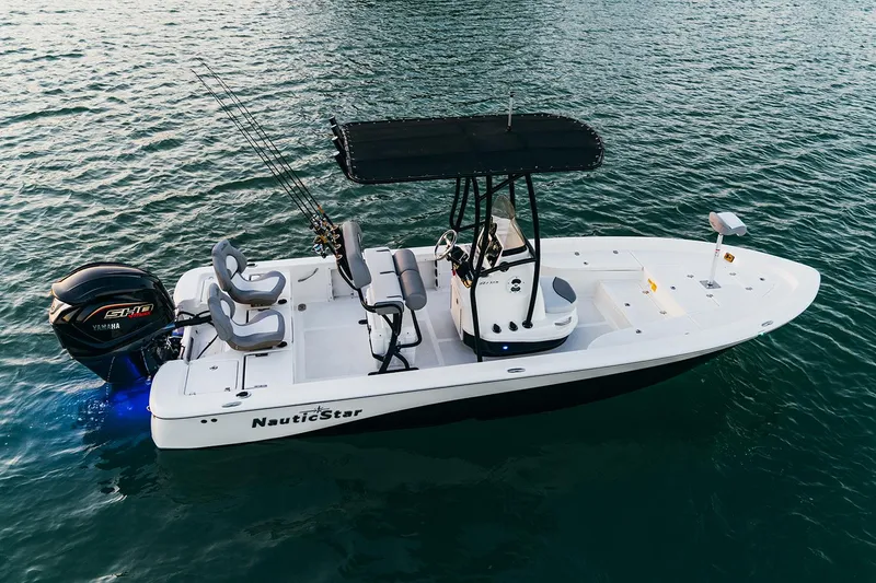 Slide: The Image of 2023 NauticStar 227 Bay boat on calm water. - 19