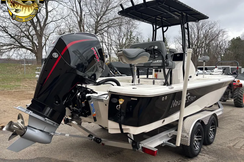 Slide: The Image of 2023 NauticStar 227 Bay boat on trailer with powerful outboard motor. - 21