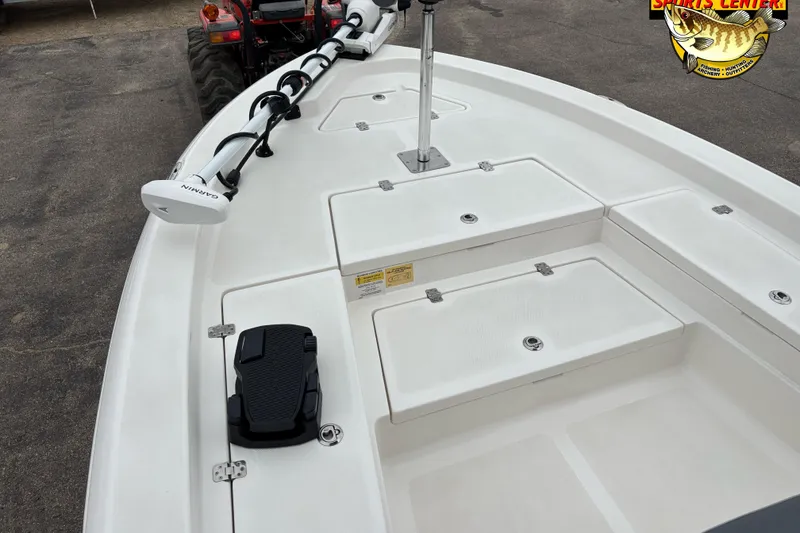 Slide: The Image of 2023 NauticStar 227 Bay boat deck with Garmin trolling motor and storage compartments. - 6