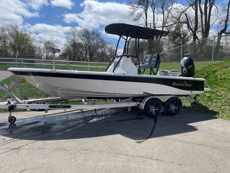 Slide: The Image of 2023 NauticStar 227 Bay boat on a trailer, ready for transport. - 8