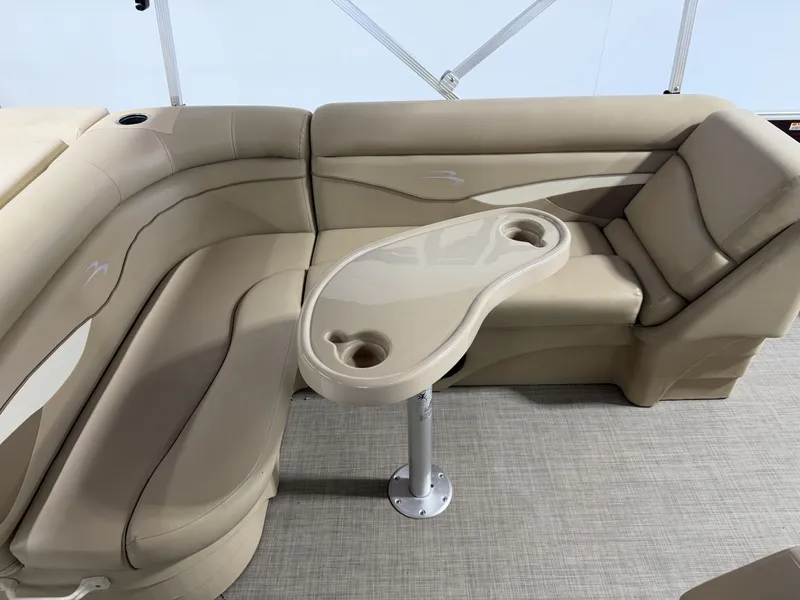 Slide: The Image of Interior of a 2016 Bennington 20SLX with beige seating area. - 9