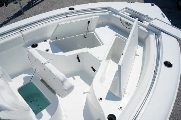 Slide: The Image of 2018 Sea Hunt Ultra 225 boat interior with open storage compartments and seating. - 21