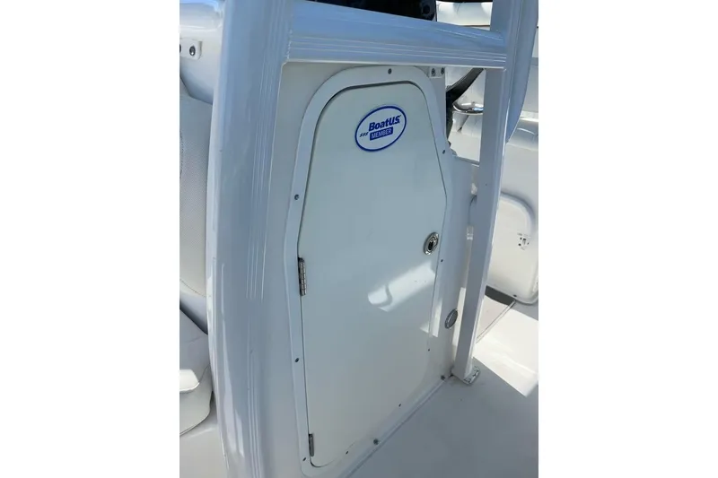 Slide: The Image of 2018 Sea Hunt Ultra 225 boat storage compartment with BoatUS member sticker. - 42