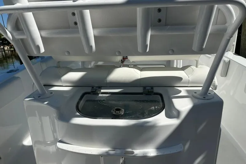 Slide: The Image of 2018 Sea Hunt Ultra 225 boat interior with seating and storage compartment. - 47