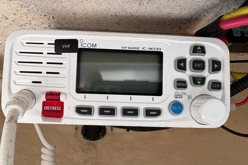Slide: The Image of VHF marine radio Icom IC-M330 with distress button on a 2018 Sea Hunt Ultra 225. - 67