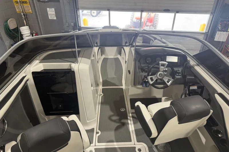 Slide: The Image of 2015 Yamaha Boats AR240 HO interior with steering wheel and seating. - 3