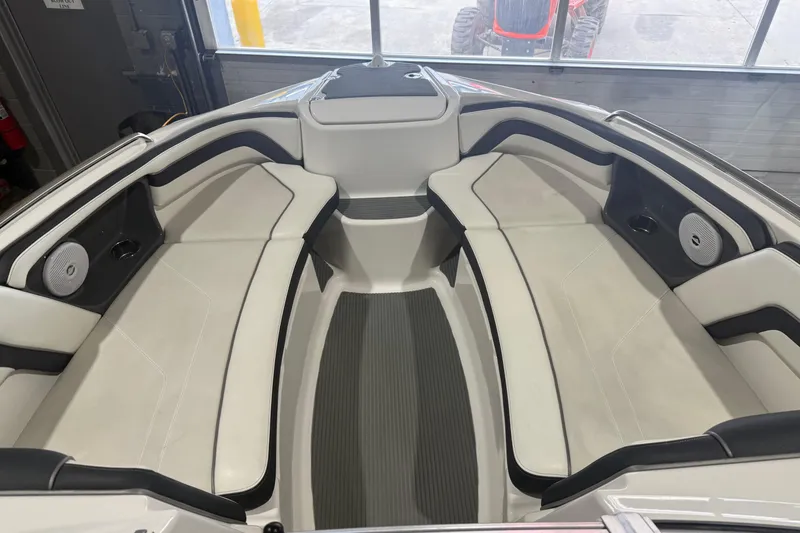 Slide: The Image of Interior of a 2015 Yamaha Boats AR240 HO, featuring spacious seating and speakers. - 5