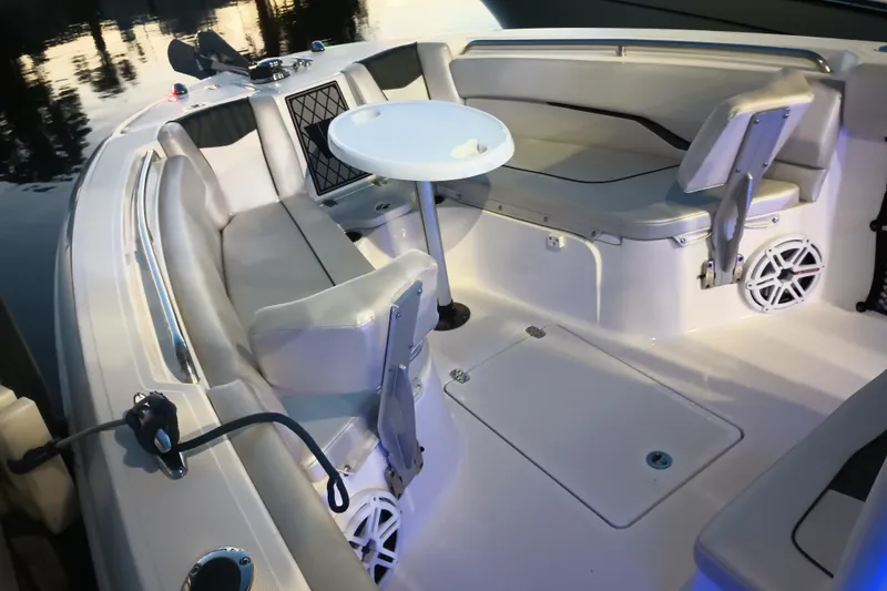 Slide: The Image of 2019 Wellcraft 242 Scarab Offshore boat dashboard with Simrad electronics and steering wheel. - 15