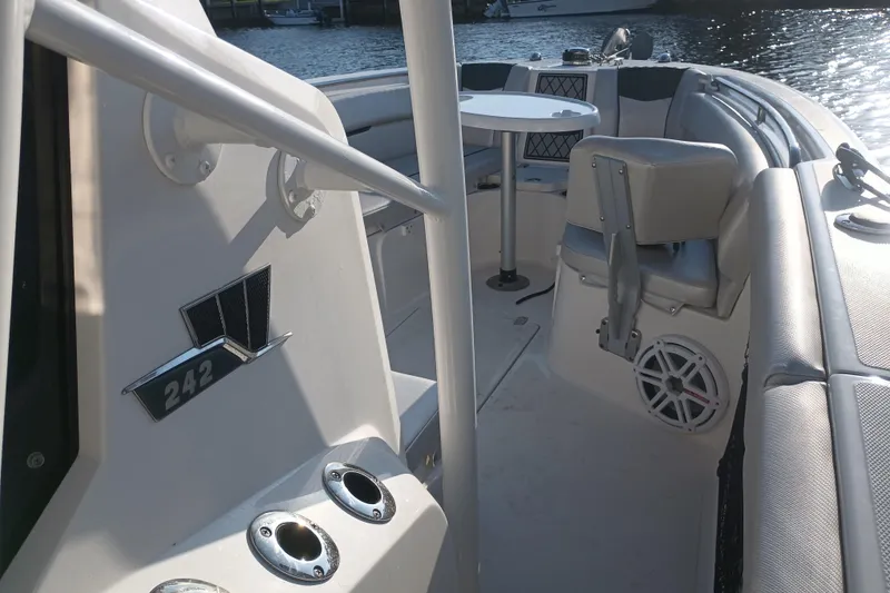 Slide: The Image of 2019 Wellcraft 242 Scarab Offshore boat with modern cockpit and navigation equipment. - 18
