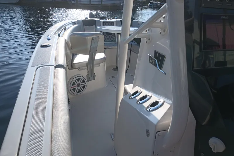 Slide: The Image of 2019 Wellcraft 242 Scarab Offshore boat interior with dual seats and control panel. - 21