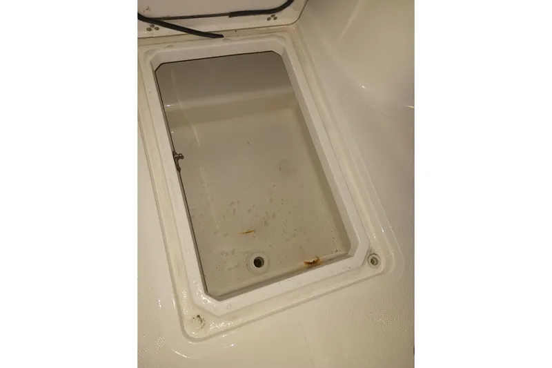 Slide: The Image of Storage compartment of 2019 Wellcraft 242 Scarab Offshore boat, showing interior details. - 31