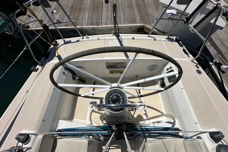 Slide: The Image of Cockpit view of 1996 J Boats J/120 sailboat with steering wheel and navigation instruments. - 25