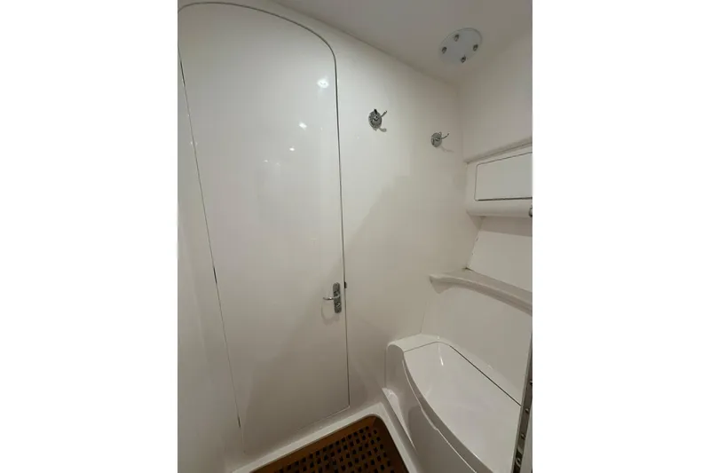 Slide: The Image of Modern bathroom interior on 2020 Intrepid 475 Sport Yacht, featuring sleek white design. - 11