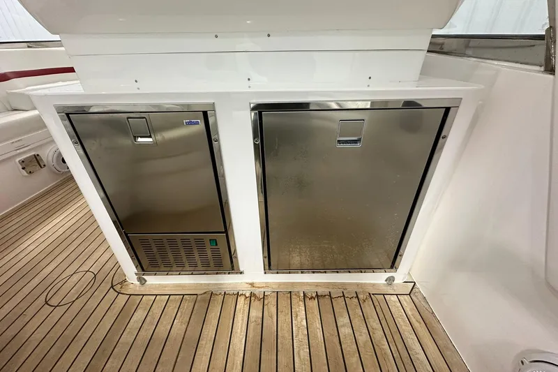 Slide: The Image of Stainless steel appliances on 2020 Intrepid 475 Sport Yacht's teak deck. - 20