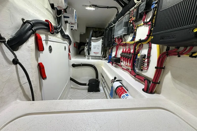 Slide: The Image of Engine room of 2020 Intrepid 475 Sport Yacht with organized wiring and equipment. - 26