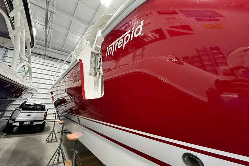Slide: The Image of Red 2020 Intrepid 475 Sport Yacht in a storage facility, side view. - 31