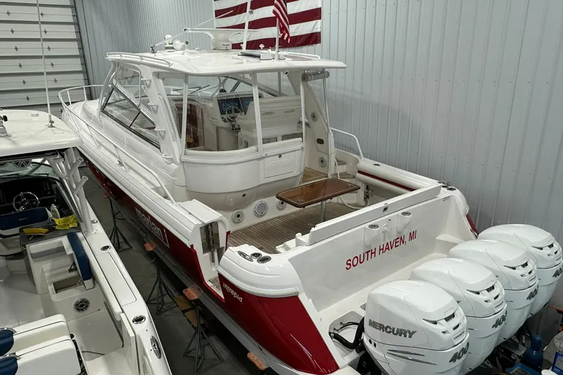 Slide: The Image of 2020 Intrepid 475 Sport Yacht in storage, featuring four Mercury engines. - 32