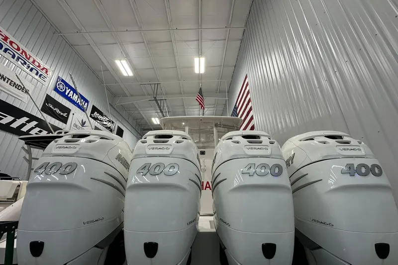 Slide: The Image of 2020 Intrepid 475 Sport Yacht with four Mercury Verado 400 engines in a showroom. - 35